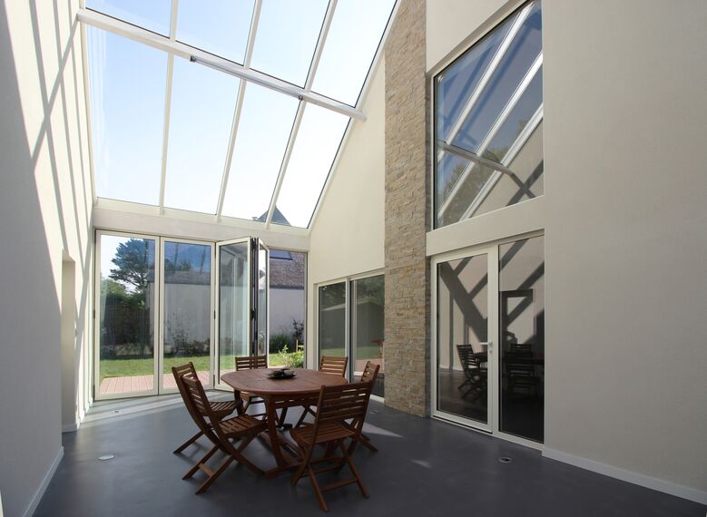 ConceptWall 50 Aluminium Façades, ThermoSystem 68 Aluminium Windows, ConceptPatio 68 Aluminium Sliding & Folding Doors and ConceptFolding 77 Aluminium Sliding & Folding Doors - House Bioclimatic Private House located in Crach, France