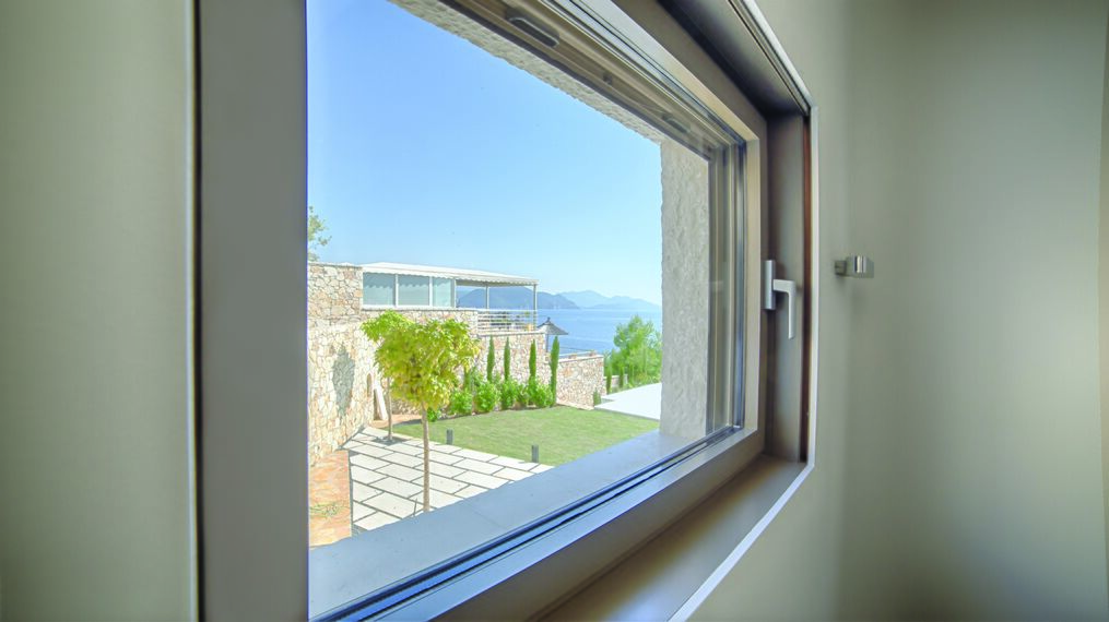 HiFinity Aluminium Sliding & Folding Doors and CS 77 Hidden Vent Aluminium Windows - Seaside villas Syvota located in Igoumenitsa, Greece