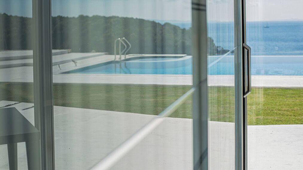 HiFinity Aluminium Sliding & Folding Doors and CS 77 Hidden Vent Aluminium Windows - Seaside villas Syvota located in Igoumenitsa, Greece