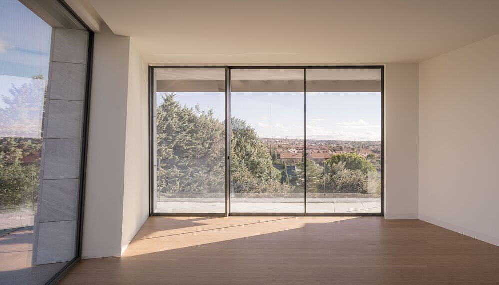 HiFinity Aluminium Sliding & Folding Doors, SlimPatio 68 Aluminium Sliding & Folding Doors and SlimLine 38 Aluminium Windows - Casa Entre Encinas located in Madrid, Spain
