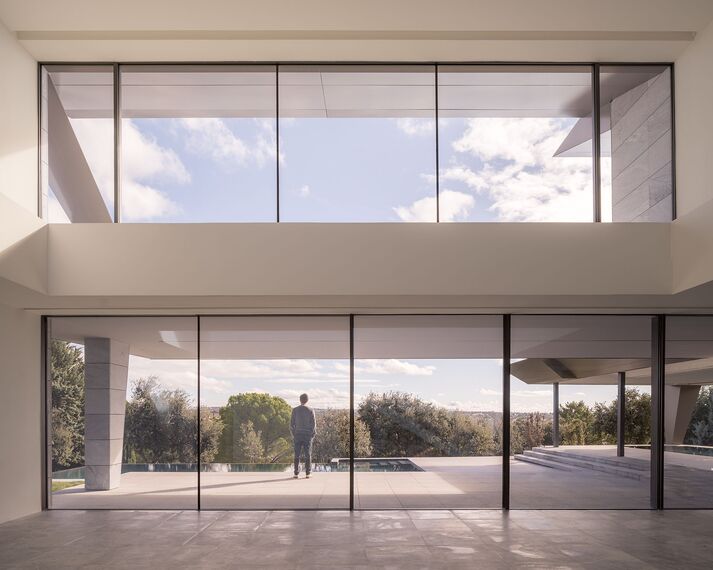 HiFinity Aluminium Sliding & Folding Doors, SlimPatio 68 Aluminium Sliding & Folding Doors and SlimLine 38 Aluminium Windows - Casa Entre Encinas located in Madrid, Spain