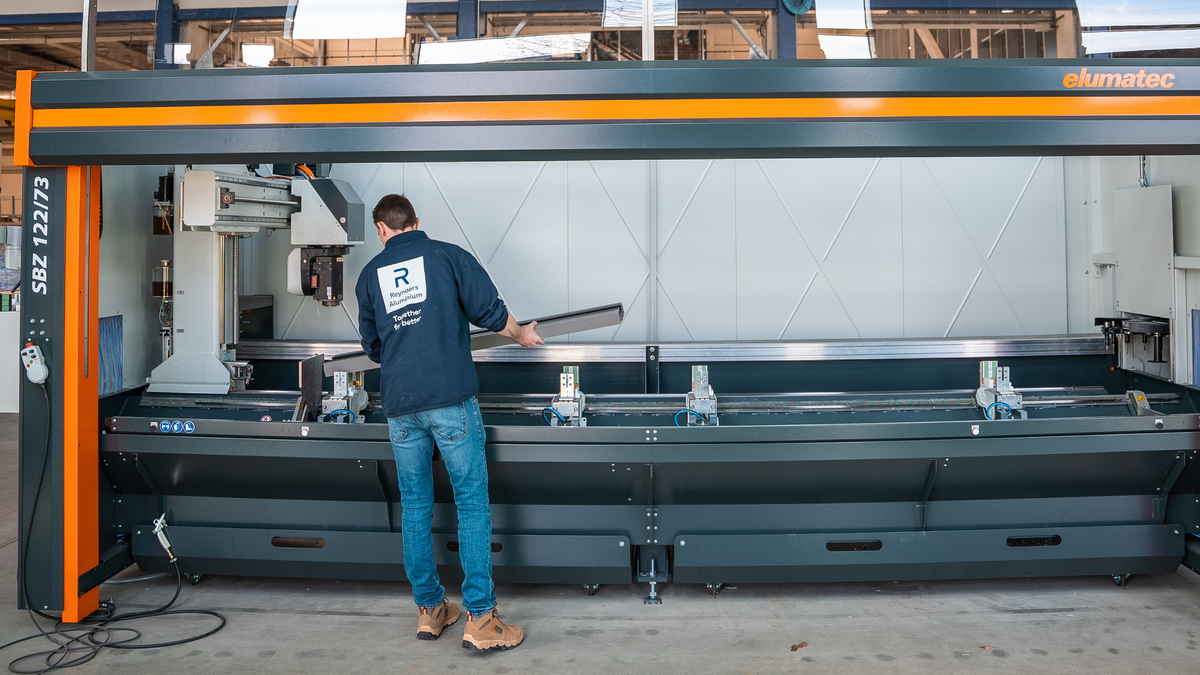 A man using a machine in a warehouse