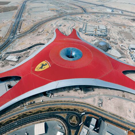 A large red building in the desert 