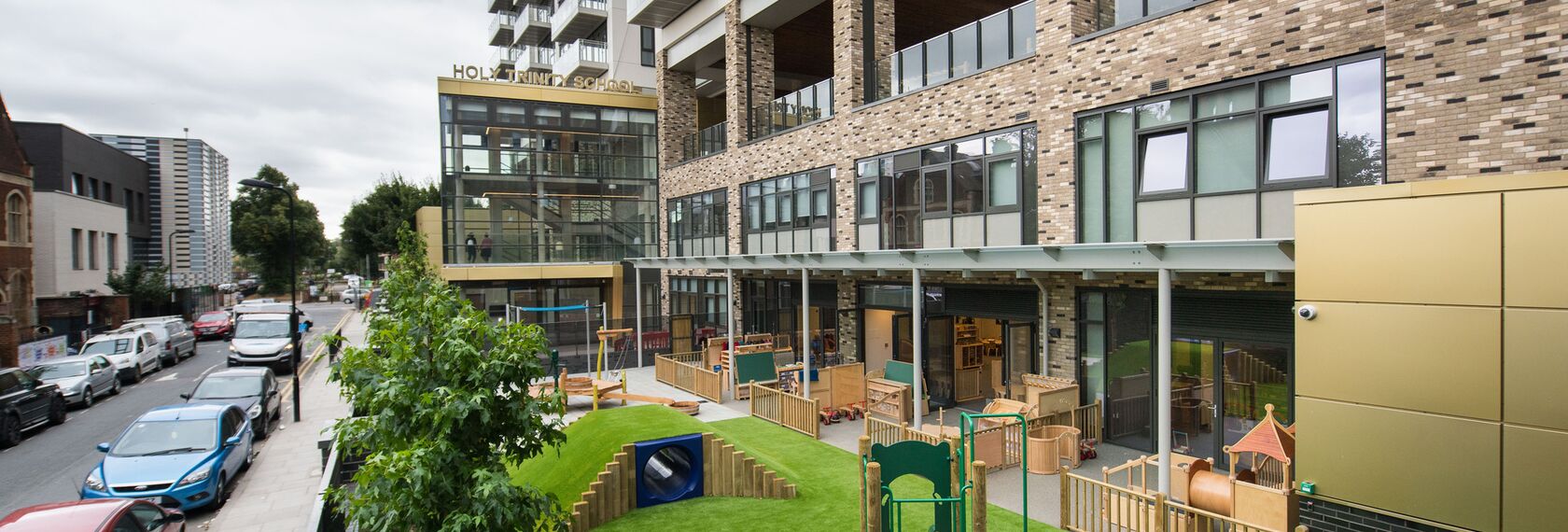 Vision 50 Aluminium Doors, ConceptSystem 77 Aluminium Windows, ConceptFolding 77 Aluminium Sliding & Folding Doors, CW 50 Standard Aluminium Façades and CW 50 Aluminium Façades - Apartmentcomplex Holy Trinity School and Vibe Apartments located in London, United Kingdom