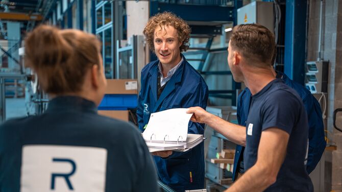 Reynaers Aluminium training centre looking through a training in a binder