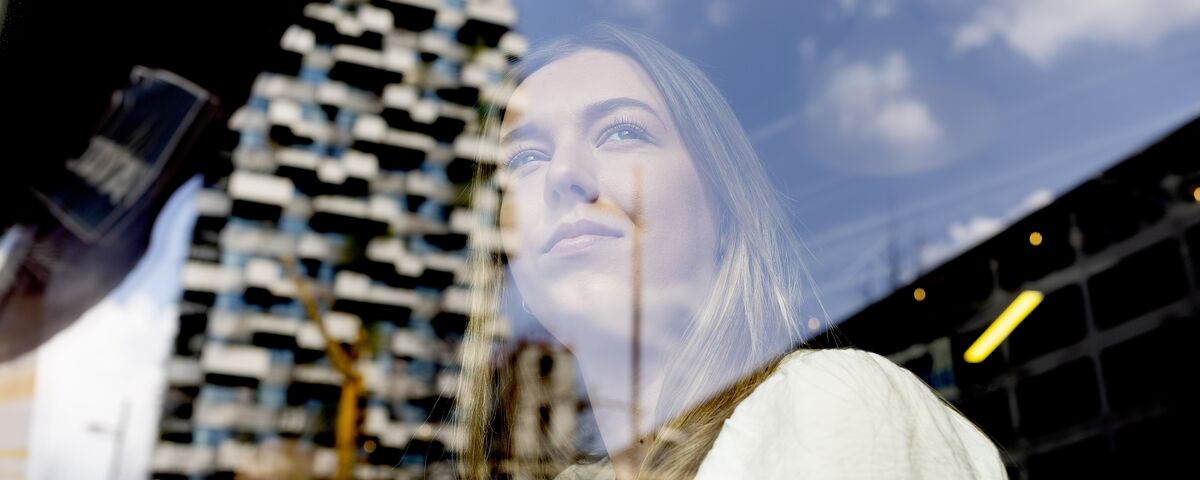 girl looking out of a window