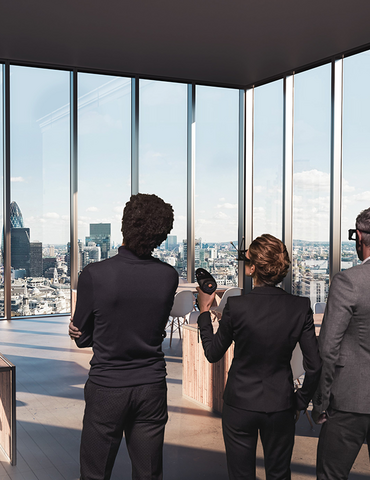 People in a virtual reality setting, looking out of a building