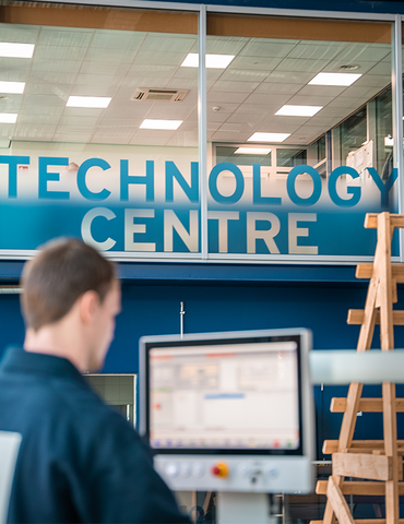 A man on a machine in a warehouse