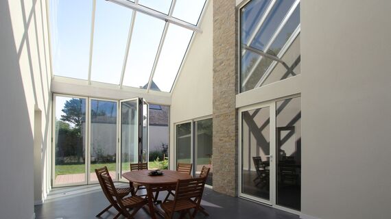 ConceptWall 50 Aluminium Façades, ThermoSystem 68 Aluminium Windows, ConceptPatio 68 Aluminium Sliding & Folding Doors and ConceptFolding 77 Aluminium Sliding & Folding Doors - House Bioclimatic Private House located in Crach, France