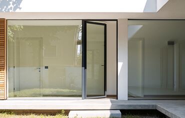 Open glass door in a modern private home.