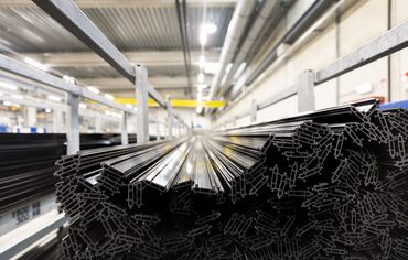 Synthetic thermal strips stacked in iron chassis in warehouse.