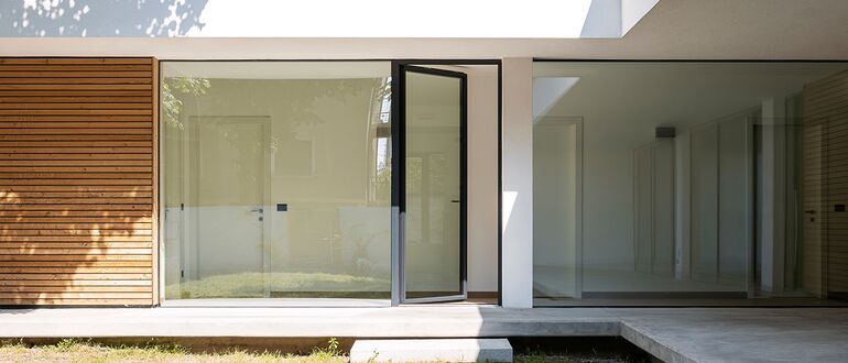 Open glass door in a modern private home.